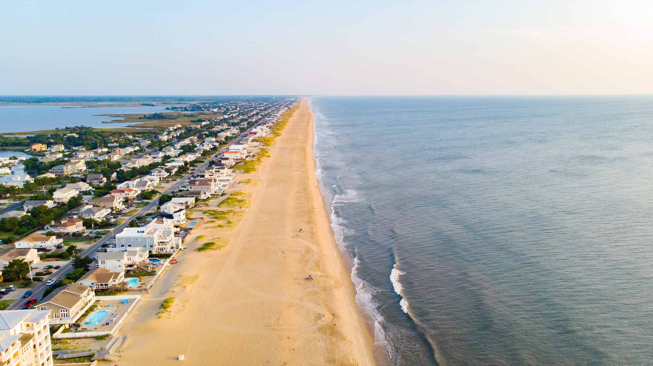 aerial image showcasing sandy beaches, rental homes, and back bay in Sandbridge Beach