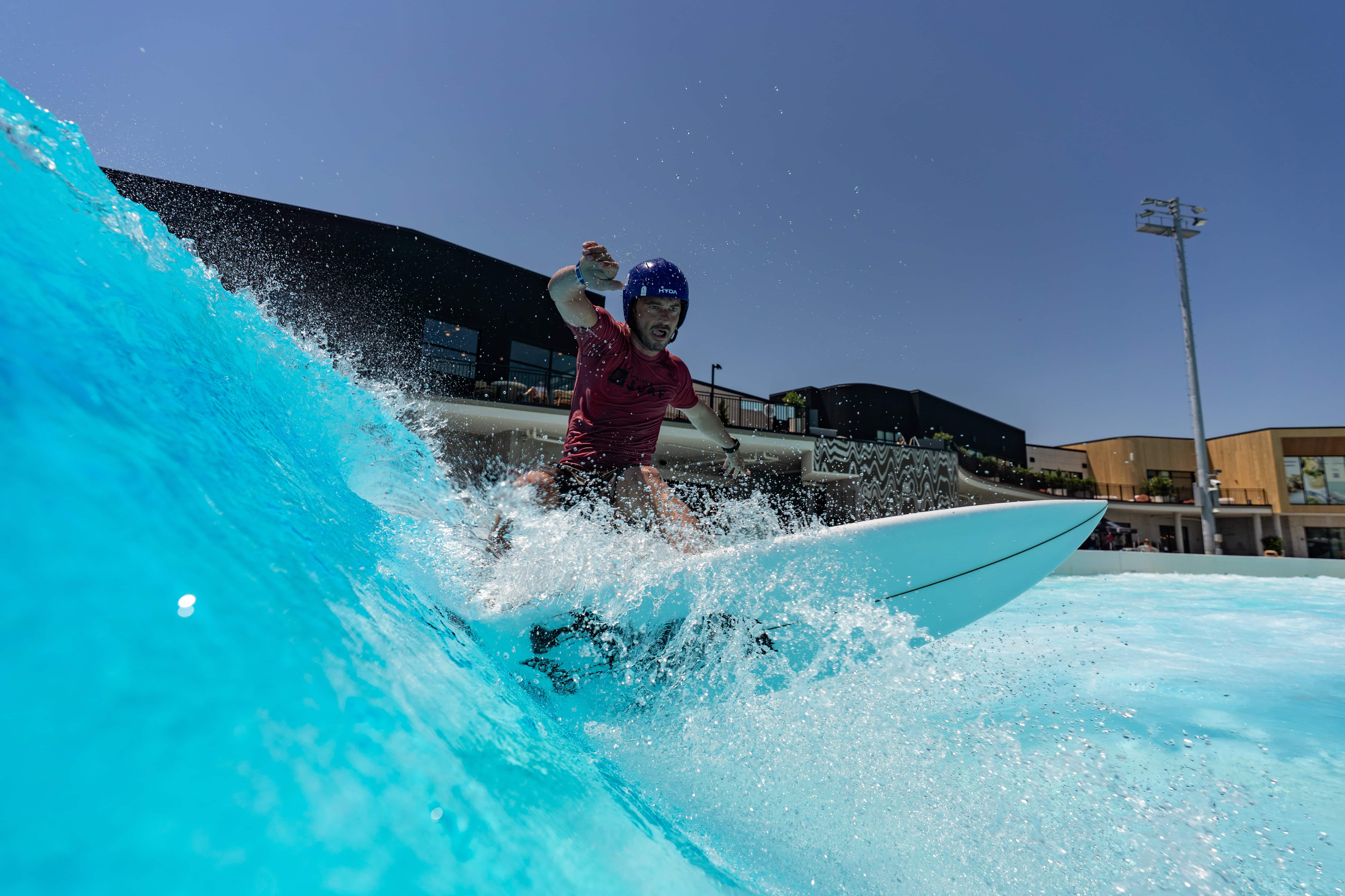 A surfer rides at wave at Atlantic Park Surf in Virginia Beach.